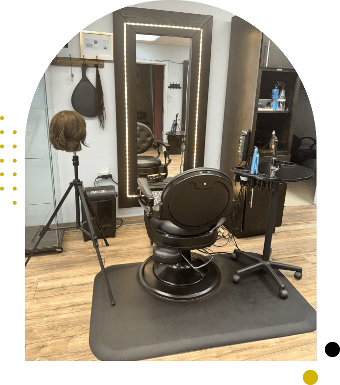 A barber shop with a chair and mirror